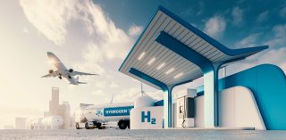 Stock Photography: Future of hydrogen energy. Hydrogen gas station with truck, jet and city in the background. 3d rendering. ; Shutterstock ID 1917333653; purchase_order: Diverses; job: ; client: ; other: 