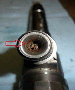Injector wear due to water in the fuel.