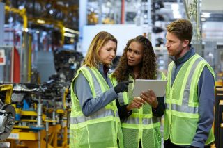 Three People in Manufacturing Facility